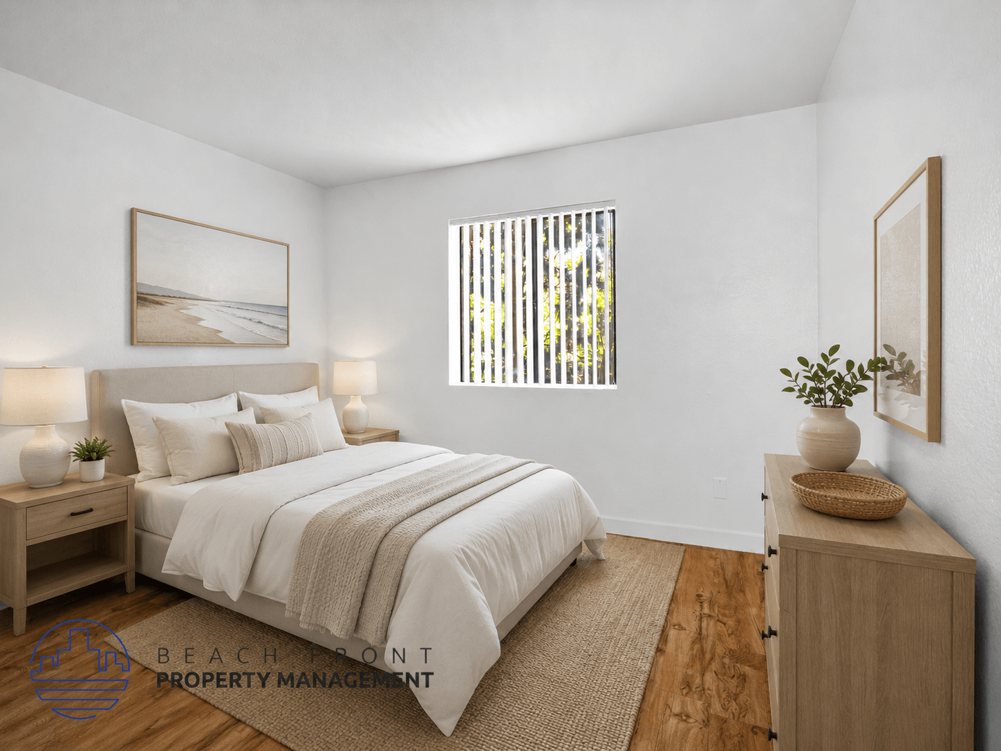 A well-lit bedroom with a large bed and a wooden cabinet.